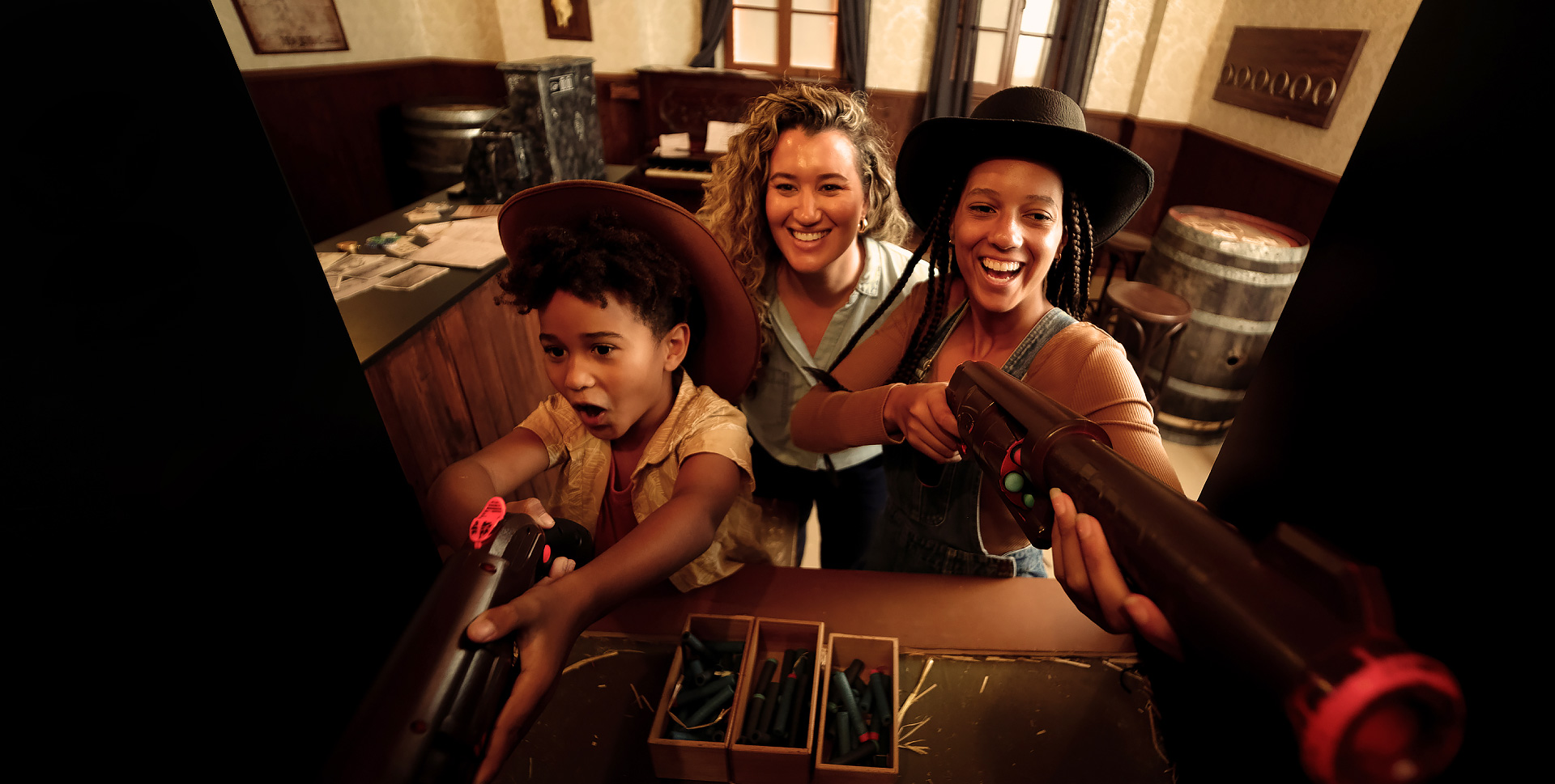 Three people are posing for a photo in a room.